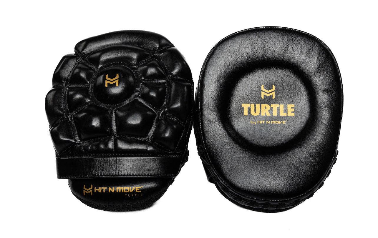 Manoplas Hit N Move (blanco/oro y negro/oro)